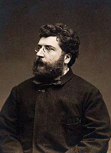 Georges Bizet, aged 37, a bearded man with spectacles in a dark coat