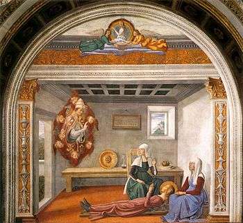 A painting shows St Fina as a blonde-haired teenage girl in a pink dress, lying on a wooden board in a small plain room. and attended by two women. Hovering before her is a vision of a pope, supported by flying cherubs.