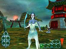 Standing in the foreground against a backdrop of oriental structures is a topless female humanoid. She has red eyes and wears a translucent skirt. She holds a tulwar in her right hand. Behind her stands a big-headed humanoid who is striking poses.