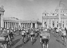 A group of cyclists riding in Rome.
