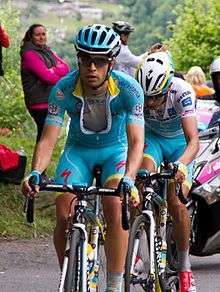 Mikel Landa, wearing the blue Astana jersey, riding ahead of Fabio Aru, who is wearing the white jersey of the best young rider