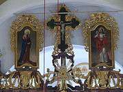 The three icons on the top of the iconostasis