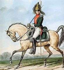 Color print of the colonel commanding the 1st Dragoon Regiment. He wears a green coat and a brass helmet with a horsehair crest and his mounted on a light brown horse.
