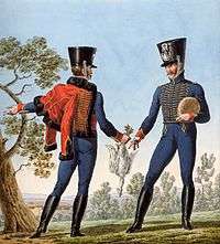 Two French 4th Hussars wear blue jackets and trousers. One trooper has a red pelisse thrown over his shoulder.