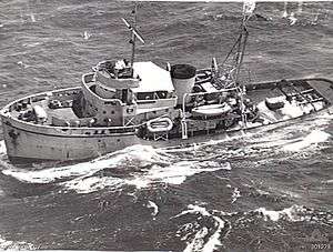 An aerial photograph of the tugboat HMAS Reserve at sea