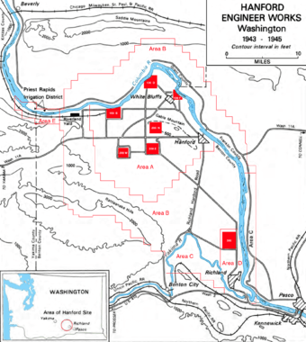 A contour map showing the fork of the Columbia and Yakima rivers and the boundary of the land, with seven small red squares marked on it