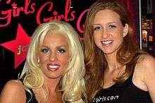 Heather Veitch and Tanya Huerter, both wearing JC's Girls T-shirts and working the booth at the 2006 Adult Entertainment Expo