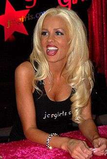 Heather Veitch wearing a JC's Girls T-shirt while working the booth at the 2006 Adult Entertainment Expo