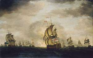 An oil painting depicting a sea battle. The sky has dark clouds with patches of blue, and the sea is grey. Warships are visible in the distance, some of which are exchanging cannon fire.  A British warship occupies the centre foreground, obscuring an explosion behind it.