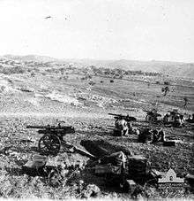 An artillery battery of four guns deployed in the hills
