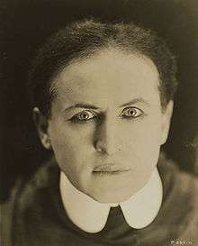 A close-up of Houdini staring to the camera