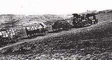 Tractor pulling ammunition wagons