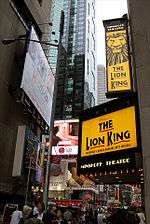 The façade of Minskoff Theatre at Broadway, with banners promoting the Lion King musical.