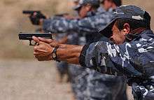 Soldiers target-shooting with handguns