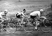 Cyclists riding together.