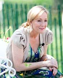 J.K. Rowling, a blond, blue-eyed woman, who is the author of the series