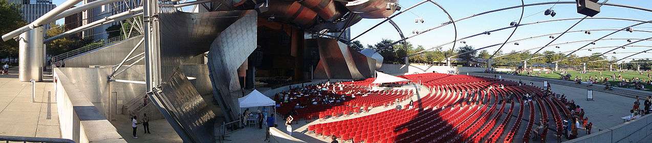 Panoramic shot of the Jay Pritzker Pavilion, showing the stage area to the garden seating area.