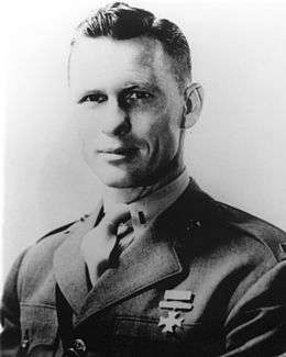 black and white headshot of Jack Lummus in his military uniform