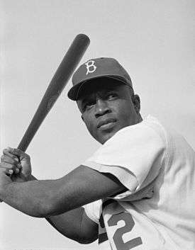 Jackie Robinson of the Brooklyn Dodgers, posed and ready to swing