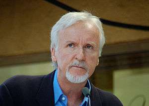 James Cameron, a man in his late fifties with white hair and a goatee, pictured from the shoulders up