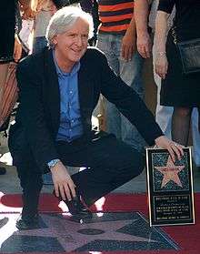 A photograph of Cameron receiving a star on the Hollywood Walk of Fame in 2009