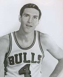 A man wearing a basketball jersey with "Bulls 4".