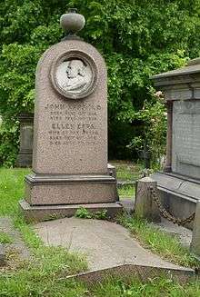 A granite gravestone with a round relief of Epps's profile