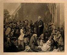 Engraving of Wesley standing on a plinth and preaching to a crowd.