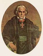 A painted half-length portrait of a white-haired man wearing a black mantle over a black tunic belted in green and with a large cross on a red ribbon about his neck
