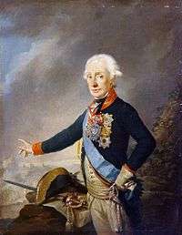 Painting shows a white-haired man standing in a blue uniform with red collar and cuffs and a light blue sash. He gestures with his right hand toward a battle scene. His bicorne hat and sword lie on a map next to him.
