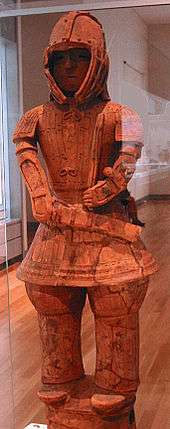 Terracotta figure of a man in armour.