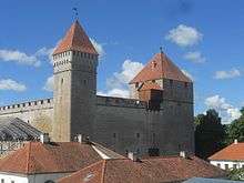 Kuressaare Castle, square stone keep with one square corner tower and red tile roof