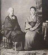 Black-and-white photo of two seated women