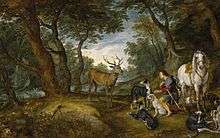 In a forest, a kneeling man holds his hand over his heart. A stag stands in front of him, his horse stands behind him, and his hunting dogs lay near-by.