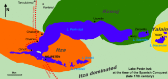 Map showing Lake Petén Itzá extending east-west. Two smaller lakes lie a short distance to the east, first Lake Salpetén and then Lake Macanché. The town of Yalain is on the north shore of Lake Macanché; Zacpetén is on the north shore of Lake Salpetén. Ixlú is on the east shore of the main lake, Uspetén is on its north shore. Chakok'ot and Chak'an are on the northwest shore, Ch'ich' is on a small peninsula on the southwest side of the lake. Nojpetén is on an island in an extension of the lake branching southeast. Beyond this branch are two small lakes, Petenxil and Eckixil. The Camino Real route to Guatemala extends south from the south shore opposite Nojpetén. The Camino Real route to Yucatán runs north around the west shore of the lake from Ch'ich' to Chak'an and then heads north away from the lake to Tanxulukmul and onwards. Kantetul is a short way to the east of Tanxulukmul. The Itza territory covered the almost the entire western half of the lake and extended further westwards, it also included the two small lakes extending from the southern branch of the lake. The area south of the main lake was Itza-dominated. The Kowoj territory covered the area northeast of the lake, and the easternmost portion of the south shore. It extended around Lake Zacpetén. Yalain territory surrounded the small Macanché lake.