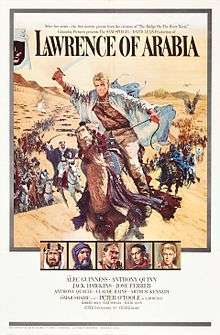 A painting occupies about 3/4 of the frame. A man riding a galloping horse across sand is the most prominent image. The man is holding a raised scimitar in his right hand; he is wearing a white robe, suggestive of Arabian clothing, but looks to be European with blond hair. Behind him are many more mounted men charging with raised swords, extending far into the background and a sandy hill. At the top of the painting, which shows the sky above the hill, the words "Lawrence of Arabia" are written using a large, formal font suggestive of printing. Two lines of small lettering above these words have the phrases "After five years .... the first motion picture from the creators of 'The Bridge on the River Kwai'" and "'Columbia Pictures presents the SAM SPIEGEL - DAVID LEAN production of'". Beneath the main painting are a row of five small painted portraits of five men wearing Arabian and European dress; one is the same man leading the charge in the main painting. Beneath these paintings is the billing block of the poster: "starring Alec Guinness - Anthony Quinn / Jack Hawkins - Jose Ferrer / Anthony Quinn - Claude Rains - Arthur Kennedy / with Omar Shariff as 'Ali' - introducing Peter O'Toole as 'Lawrence' / screenplay by Robert Bolt - produced by Sam Speigel - directed by David Lean / Photographed in Super Panavision 70 - a horizon picture in Technicolor".