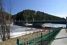 A bridge crosses an icy river