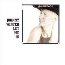 Johnny Winter, wearing a broad-brimmed hat