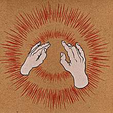 Two human hands making gestures in front of exploding red lights on a brown background.