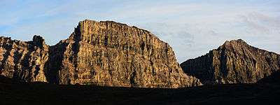 Limestack Mountain, a tall limestone fin with sheer cliffs in the central Brooks Range