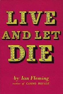 A book cover, in deep red. In large yellow / gold stylised type are the words "Live And Let Die". Underneath, in smaller type "by Ian Fleming, author of CASINO ROYALE".