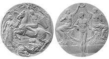 Two grey circular medals are shown side by side. The one on the left depicts a man riding a horse over a dragon, next to an angel; the one on the right shows two partially clothed women holding a laurel wreath over a naked man.
