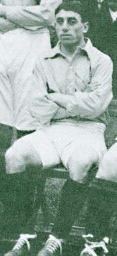 A black-and-white photograph of a young Semitic-looking man in association football attire, cropped from a formative shot of a football team.
