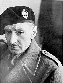 Black and white photograph of a man wearing military beret and uniform