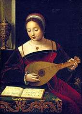 A colour painting of a woman in a red sixteenth century dress playing a lute and looking at a book of music on a covered table, a decorated object can be seen in a window niche in the background.