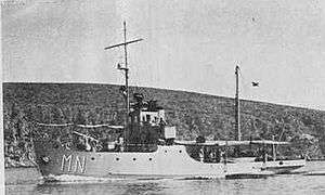 a black and white photograph of a small ship