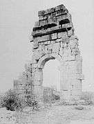 Photograph showing a standing fragment of a wall of the basilica in 1887