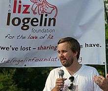 Matt Logelin speaks to the crowd at an event for The Liz Logelin Foundation.
