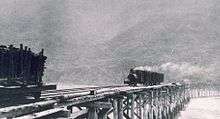 Logging train crossing the Mattole River mouth, circa 1900