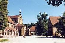 Monastery courtyard with the gothic church on the left and monastery buildings on the right
